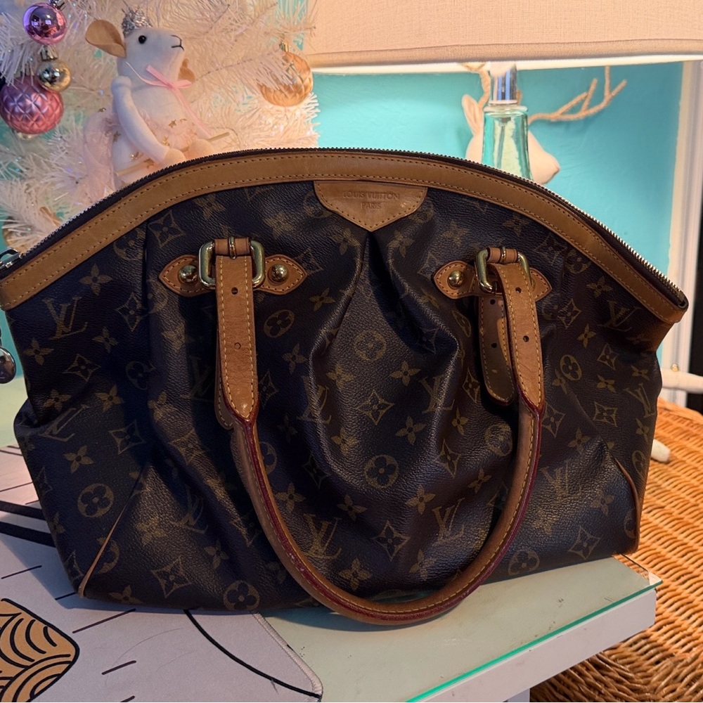 Louie Vuitton Tivoli Monogram Bag with authentic certificate
